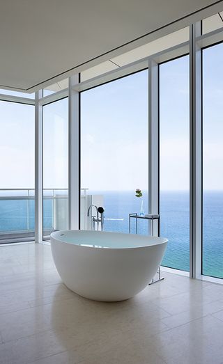 Bathtub and outside view at The Seamarq Hotel