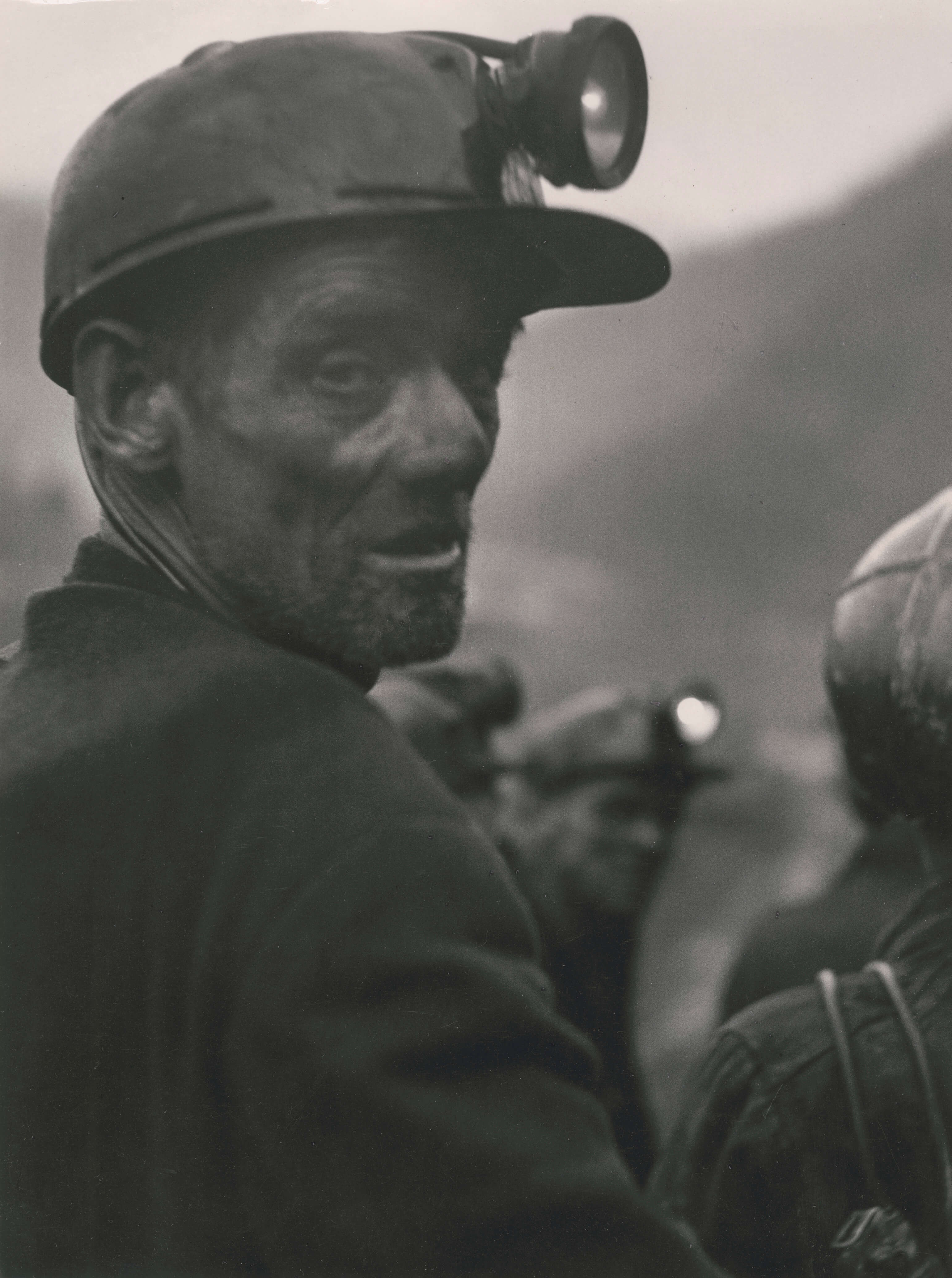 A man covered in coal soo.t