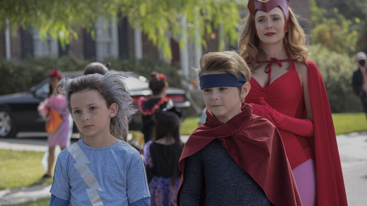 Wanda Maximoff with her twin boys Bill and Tommy play fancy dress in WandaVision on Disney Plus