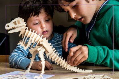 two boys playing wooden toys