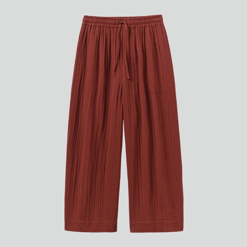 A cutout of dark red elasticated waist trousers