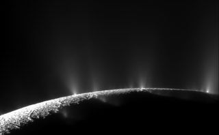 The plumes of the Saturn moon Enceladus, captured spewing from the moon's surface by NASA's Cassini spacecraft from a distance of 9,000 miles (14,000 kilometers) in 2010.