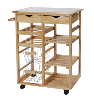 A tile top butchers block on castors with various open shelves and drawers