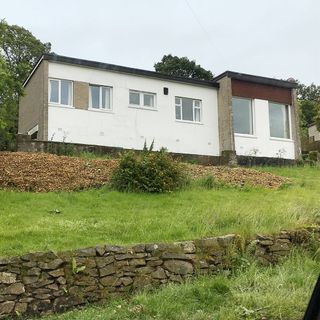 1950s dated bungalow on a hill