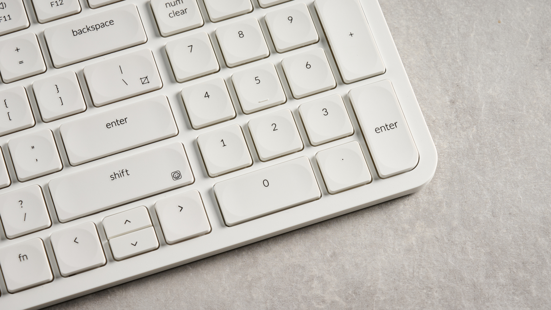 Keychron B2 Pro ultra-slim low profile keyboard in white photographed on a grey background.