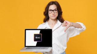 A woman giving a thumbs-down to a laptop with the M3 logo on screen.