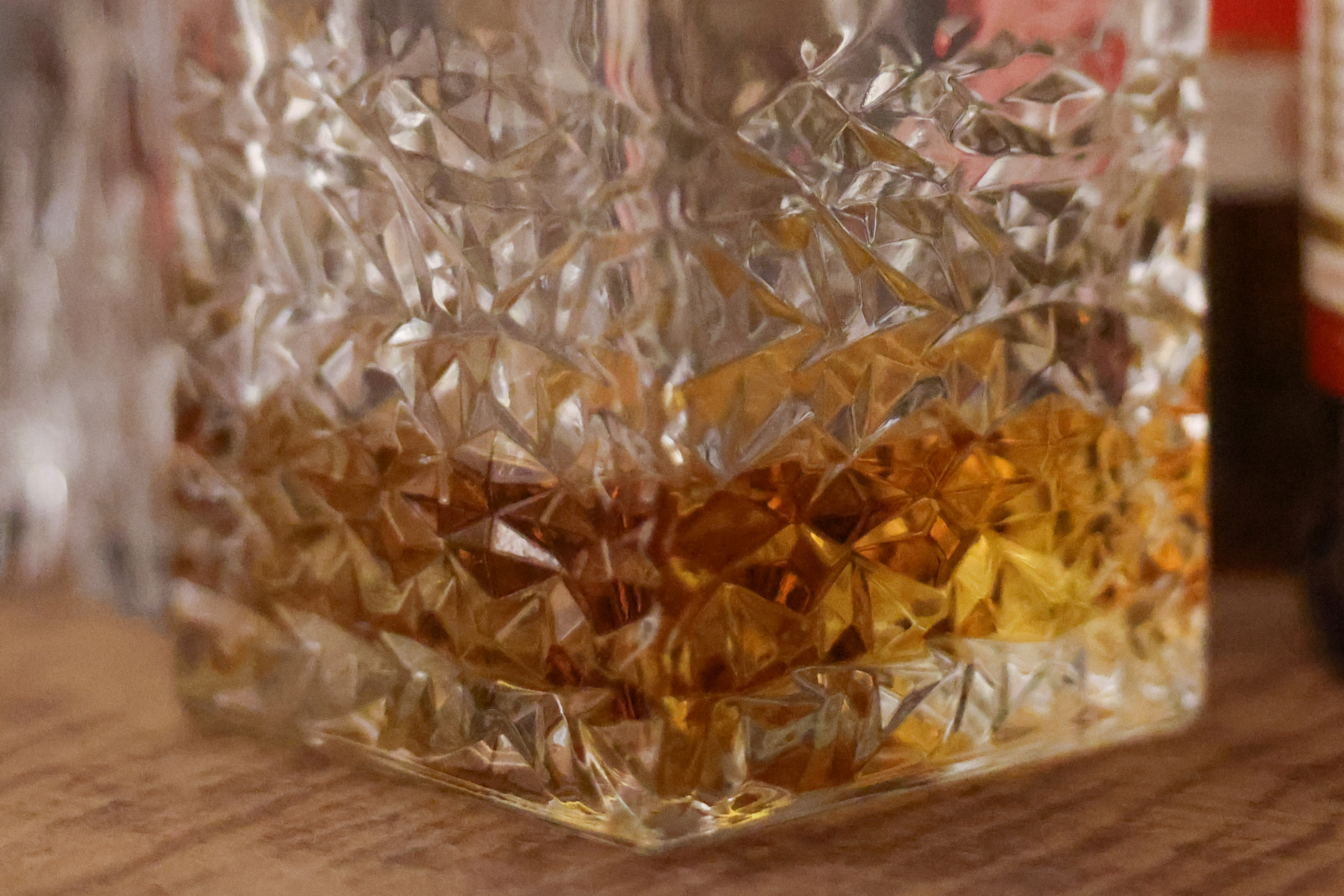 A close crop of the base of a whisky decanter shot at ISO 12,800