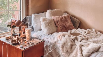 A brown and white cozy dorm room