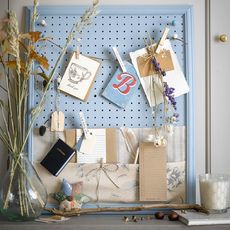 blue notice board on white walls