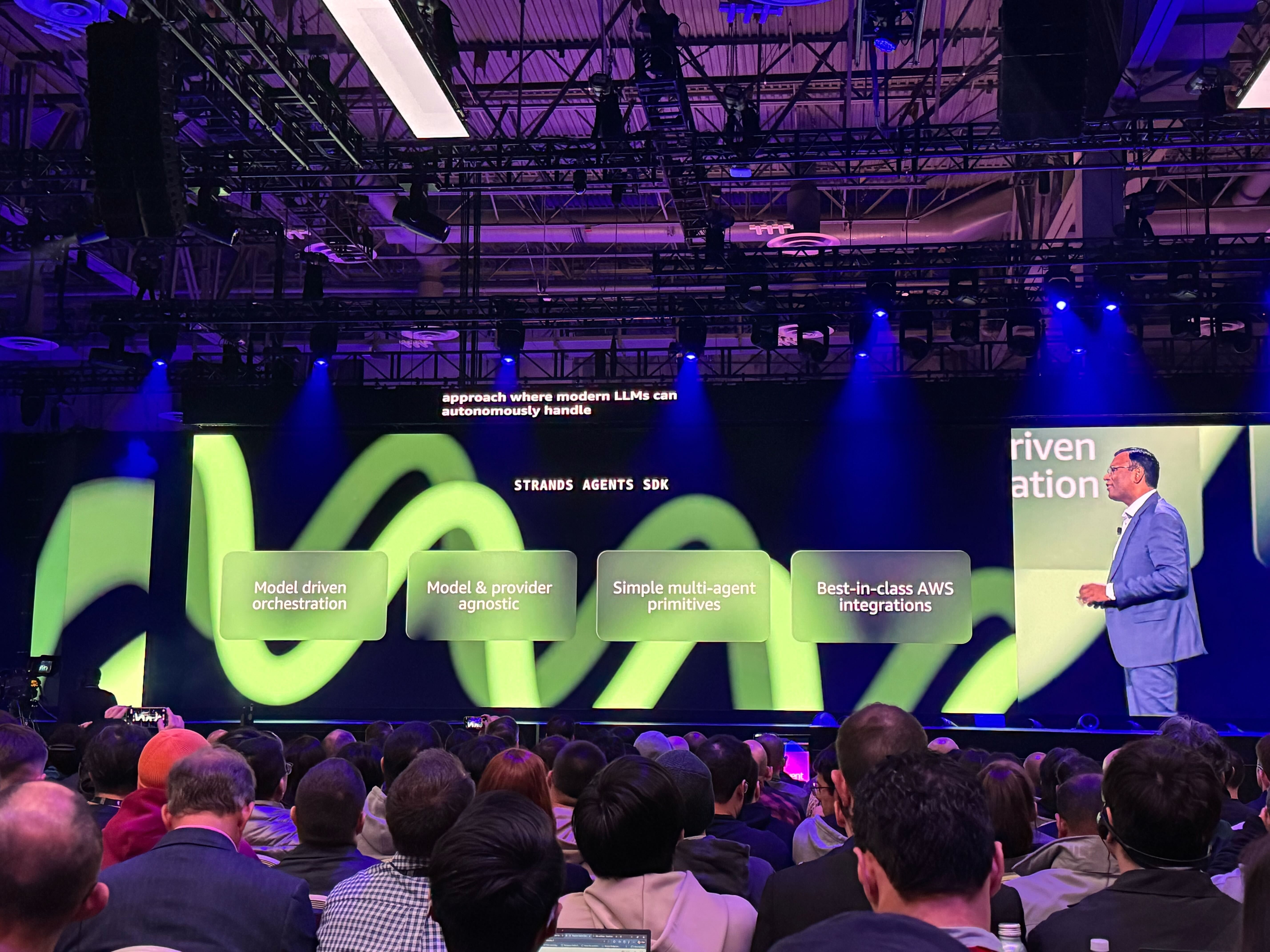 Swami Sivasubramanian pictured on stage discussing Strands SDK during his keynote presentation at AWS re:Invent 2025.