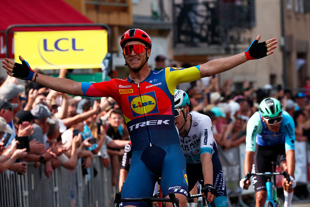 Lidl-Trek&#039;s Italian rider Jonathan Milan celebrates after crossing the finish line to win the 2nd stage of the 77th edition of the Criterium du Dauphine cycling race, 204,6 km between PrÃ©milhat and Issoire, on June 9, 2025. (Photo by Anne-Christine POUJOULAT / AFP)