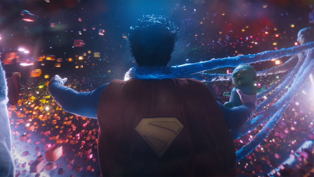 Superman holding baby Joey in his right hand as an explosion occurs in James Gunn's Superman film