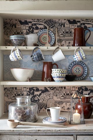 farmhouse style dresser with decorated shelves with colorful crockery