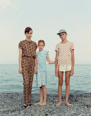 Photograph of three children on the beach