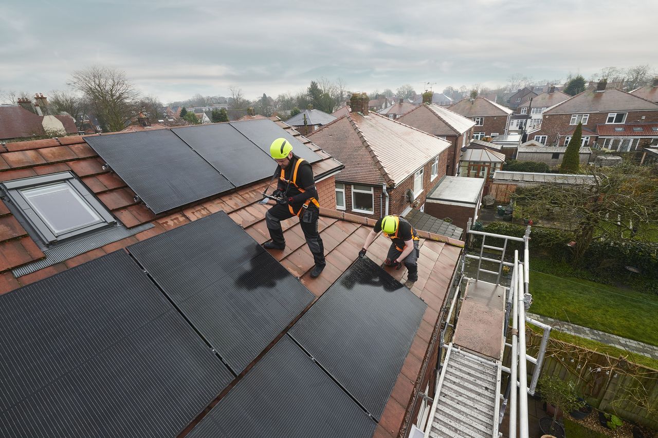 Solar panels being installed on a UK property&#039;s rooftop