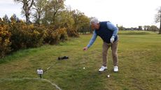 A player taking a drop from ground under repair