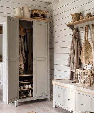 entryway with a wardrobe for coats and shoes and a storage bench