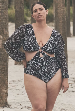 woman wearing a black and white printed one-piece