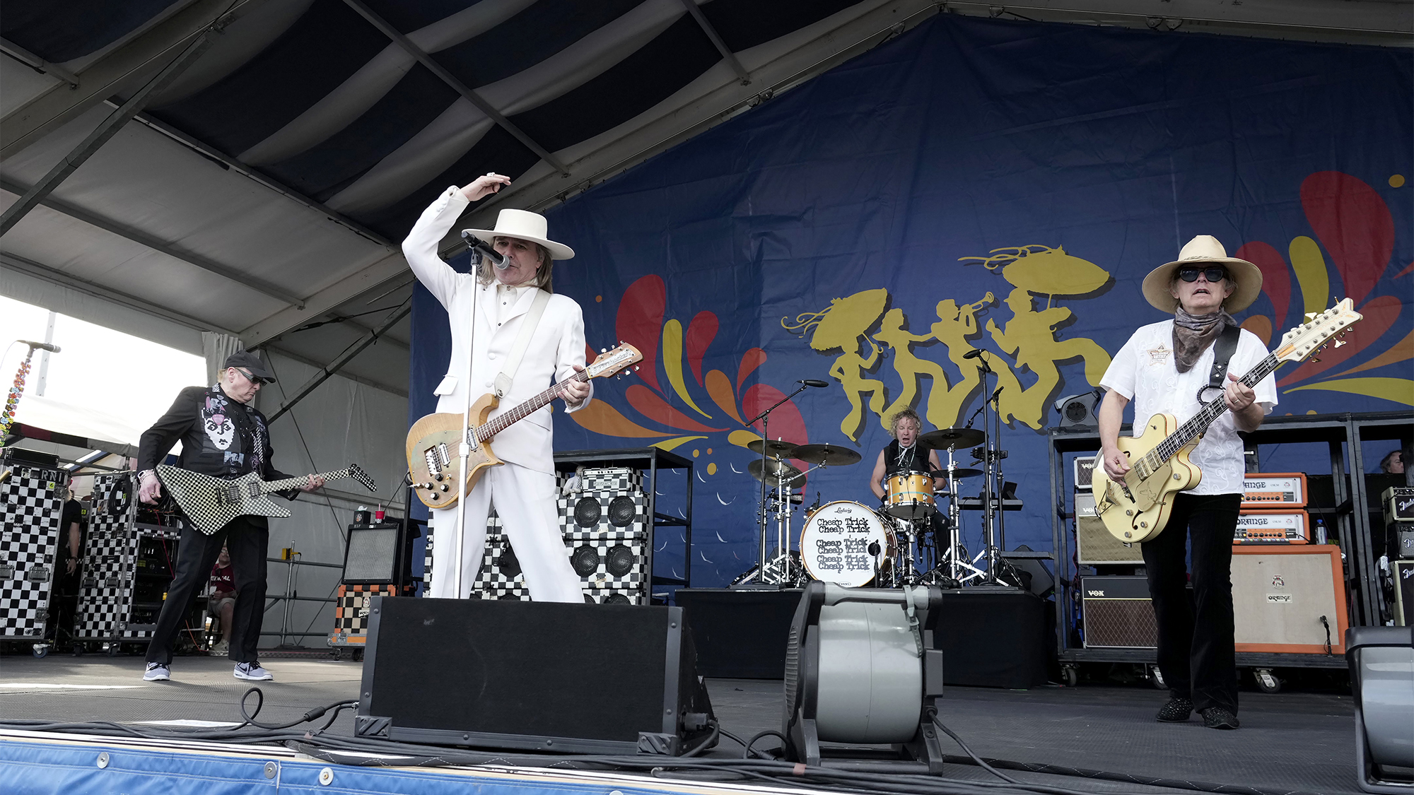 Cheap Trick at the 2025 New Orleans Jazz &amp;amp; Heritage Festival at Fair Grounds Race Course on April 25, 2025 in New Orleans. (from left) Rick Nielsen, Robin Zander, Daxx Nielsen and Tom Petersson