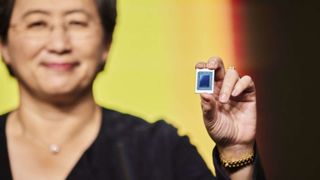 AMD CEO Dr. Lisa Su holding a chip