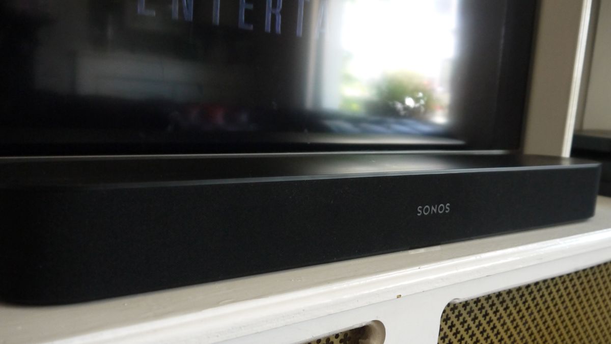 A Sonos Beam soundbar pictured below a TV