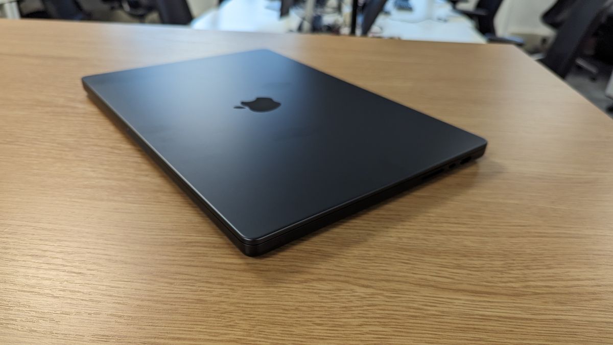 MacBook Pro 16-inch with screen open in an office