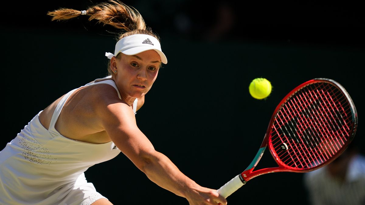 Elena Rybakina of Kazakhstan plays a backhand in the Women&#039;s Singles Final Match against Ons Jabeur of Tunisia during day thirteen of The Championships Wimbledon 2022 at All England Lawn Tennis and Croquet Club on July 09, 2022 in London, England.