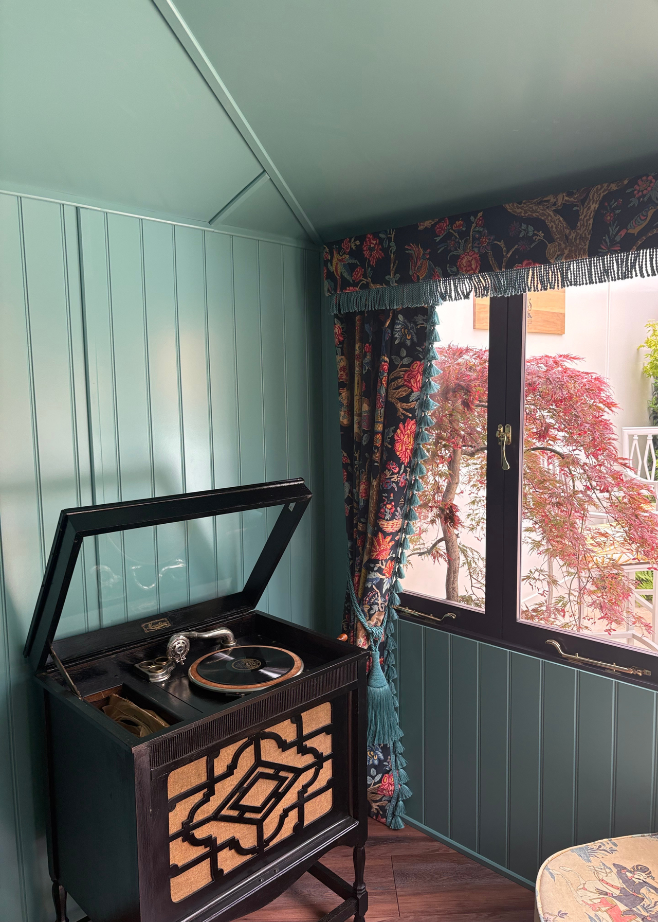An outdoor shed with a listening corner at the Chelsea Flower Show 2026