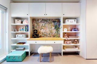 How to organize a kid's room with a built-in desk to wall to wall storage