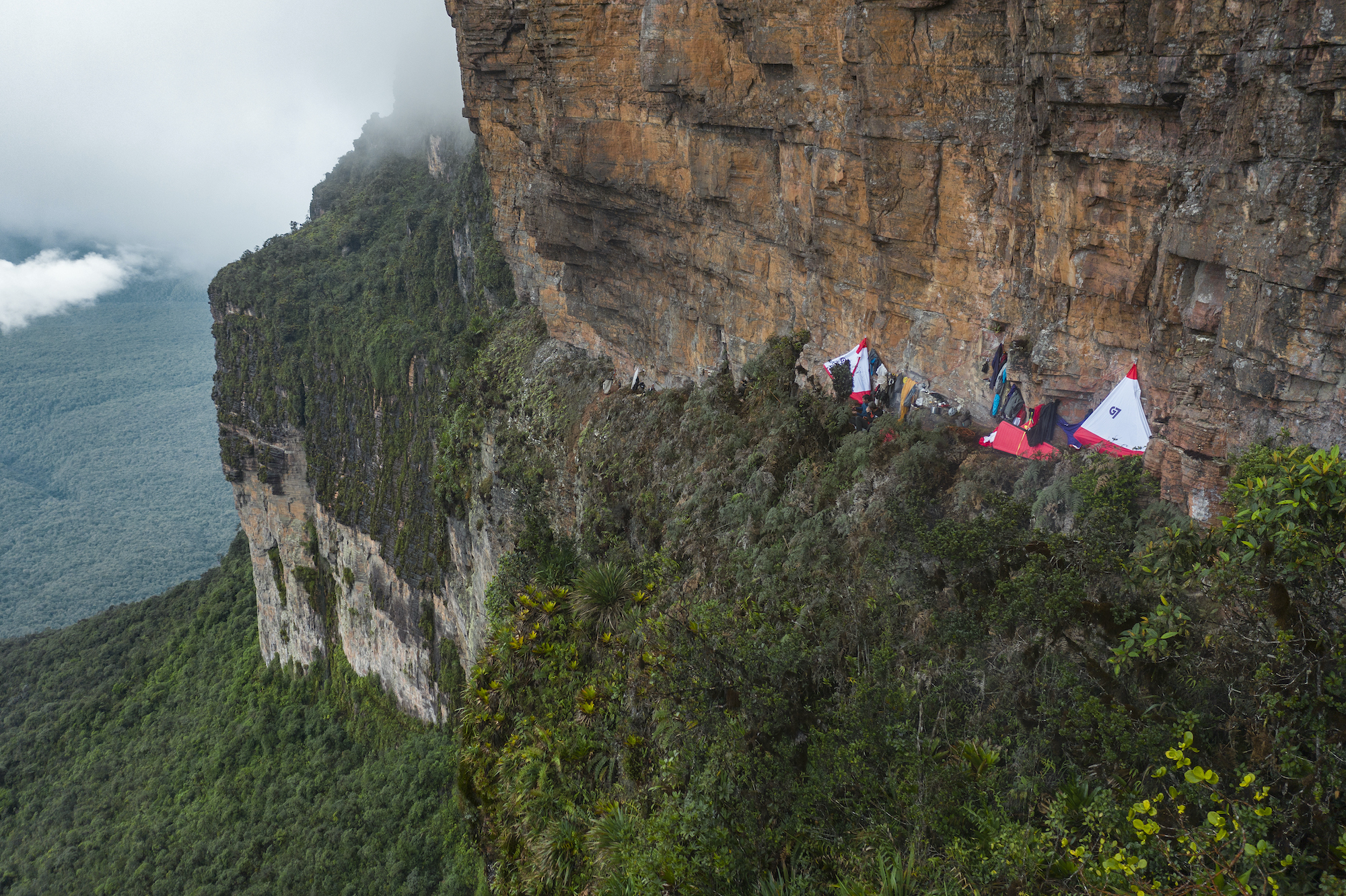 The climbing team settled into their wall camp at night on a tepui face deep in the Amazon.