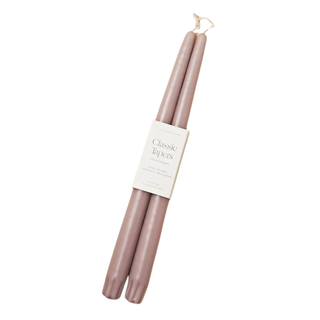 A mauve pair of classic taper candles
