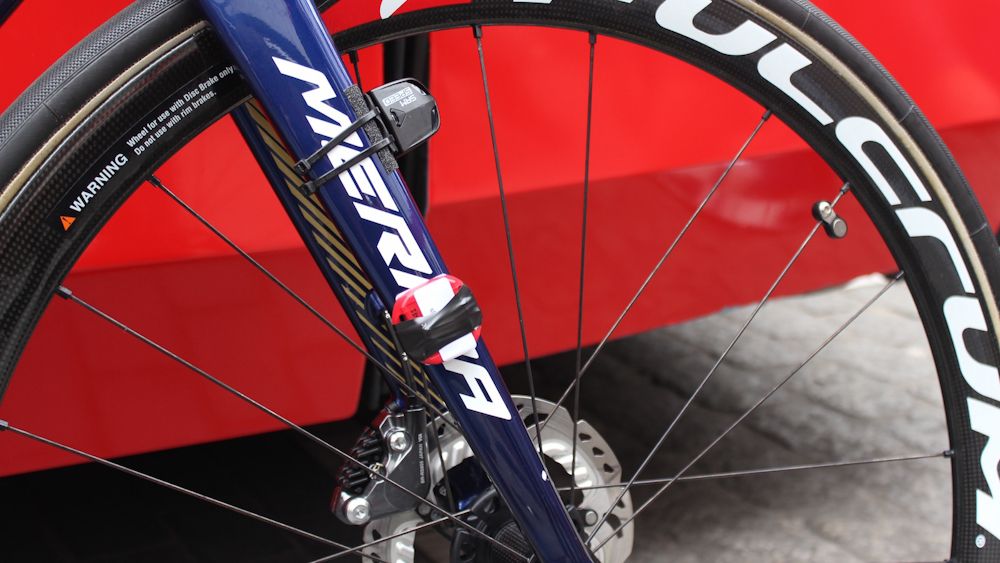 The SRM speed sensor and race timing chip are crudely attached to the fork