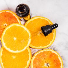 oranges next to a dropper bottle