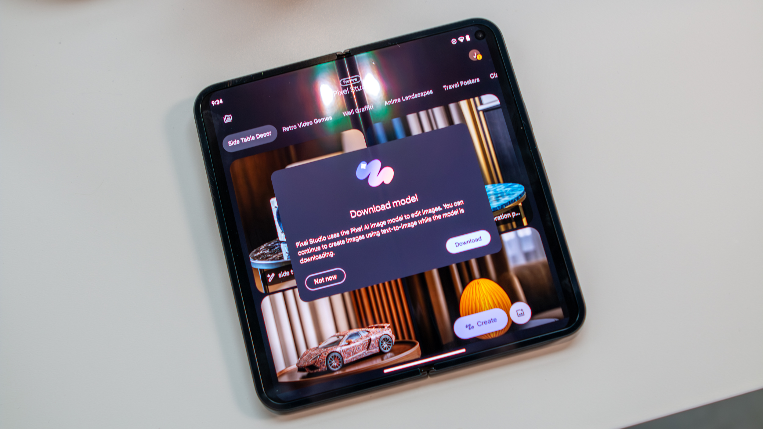 Google Pixel 9 Pro Fold showing Pixel Studio Downloading Model prompt