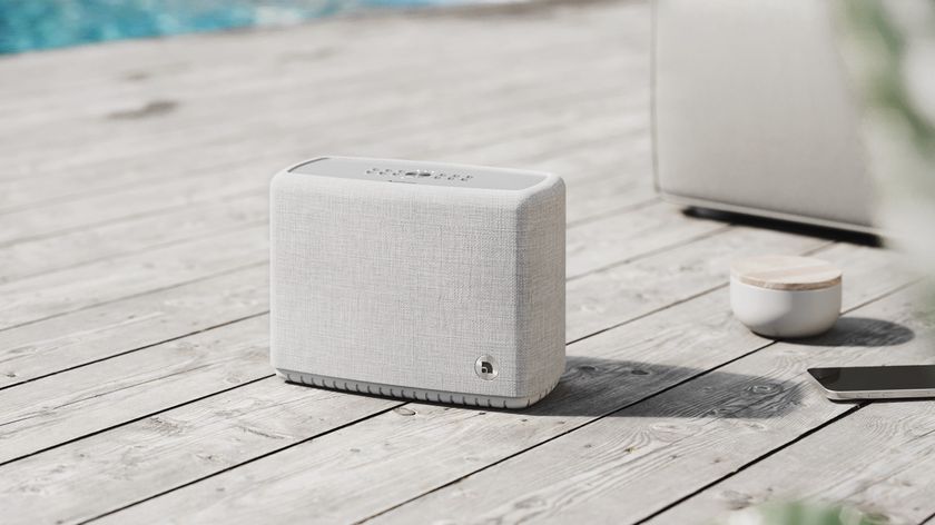 Audio Pro A15 W speaker in light grey finish placed on outdoors decking