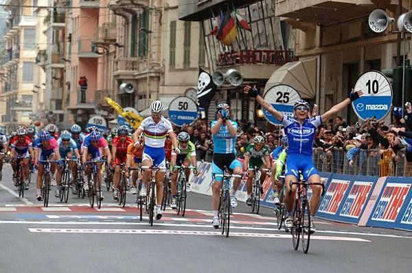 Pozzato celebrates while Petacchi claps his hands together in frustration
