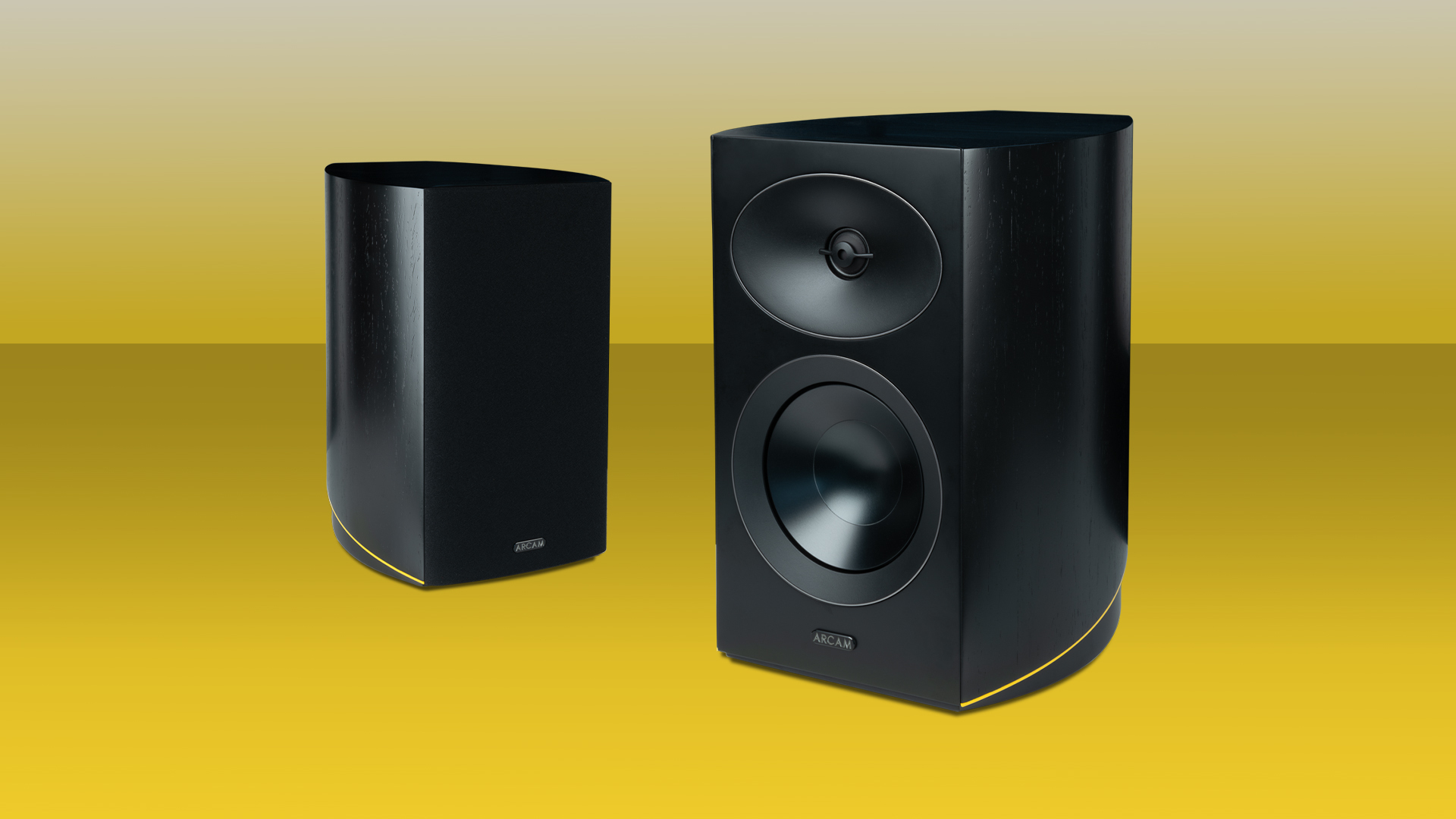Arcam Radia R25 speakers on a yellow background