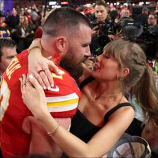 ravis Kelce #87 of the Kansas City Chiefs kisses Taylor Swift after defeating the San Francisco 49ers 2 during Super Bowl LVIII.