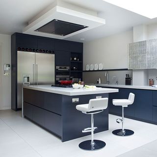kitchen room with white tiled walls and kitchen countertop