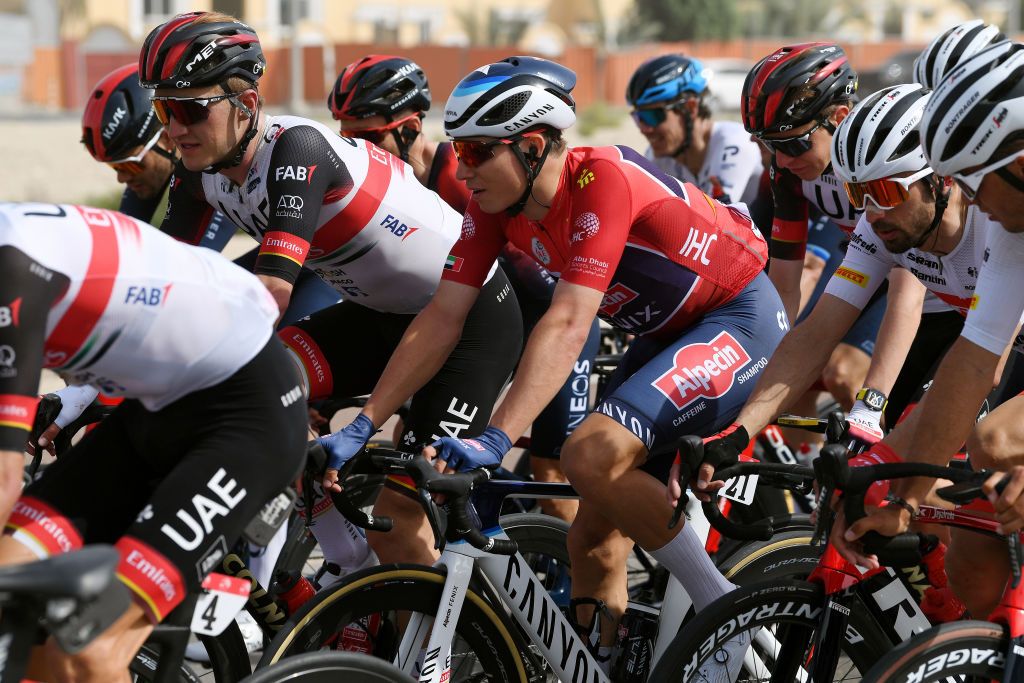 ABU DHABI UNITED ARAB EMIRATES FEBRUARY 21 LR Mikkel Bjerg of Denmark and UAE Team Emirates and Jasper Philipsen of Belgium and Team AlpecinFenix red leader jersey competes during the 4th UAE Tour 2022 Stage 2 a 176km stage from Hudayriyat Island to Abu Dhabi Breakwater UAETour WorldTour on February 21 2022 in Abu Dhabi United Arab Emirates Photo by Tim de WaeleGetty Images