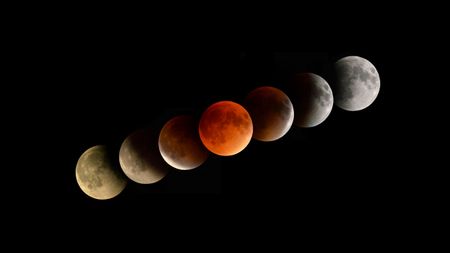 Phases of the lunar eclipse showing the blood moon in the middle.