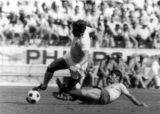 England midfielder Alan Mullery is brought down by Romania's Radu Nunweiller at the 1970 World Cup.