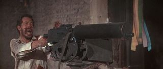 Lyle Gorch (Warren Oates) turns the heavy machine gun on Mapache's men in