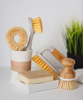 A set of natural cleaning products made from sustainable materials like bamboo