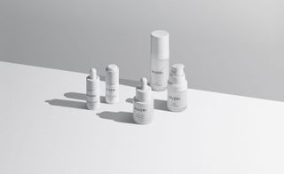 NUORI skincare products in all white packaging photographed on a white background.