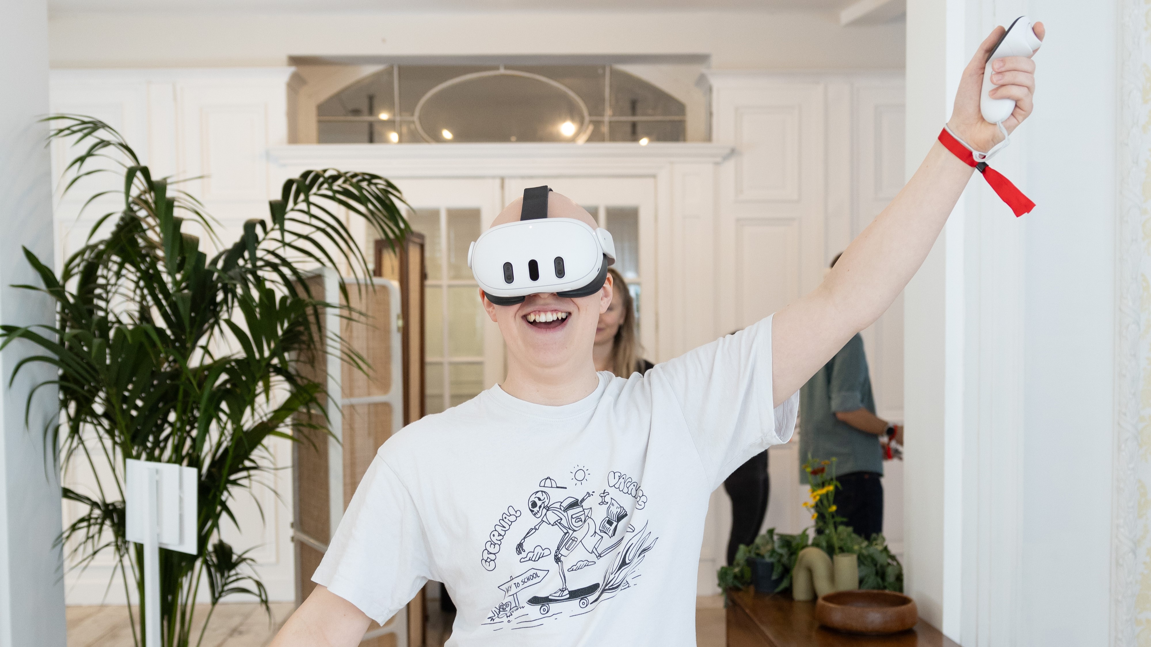 Hamish striking a disco dance pose while wearing the Meta Quest 3 headset