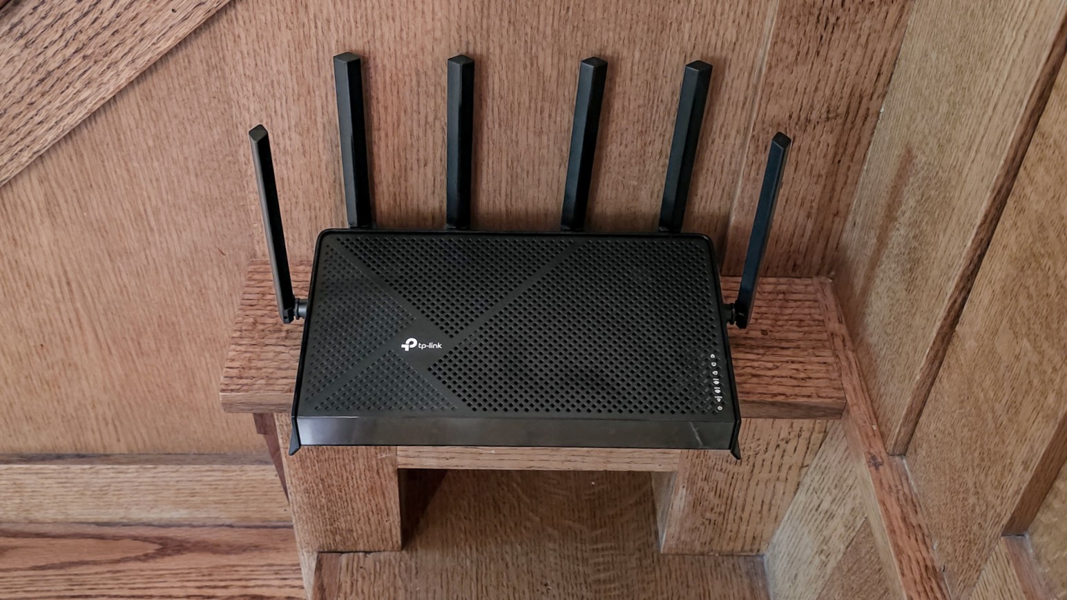 The TP-Link Archer BE9700 on a bench