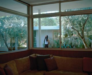 Man outside window of Californian modernist home