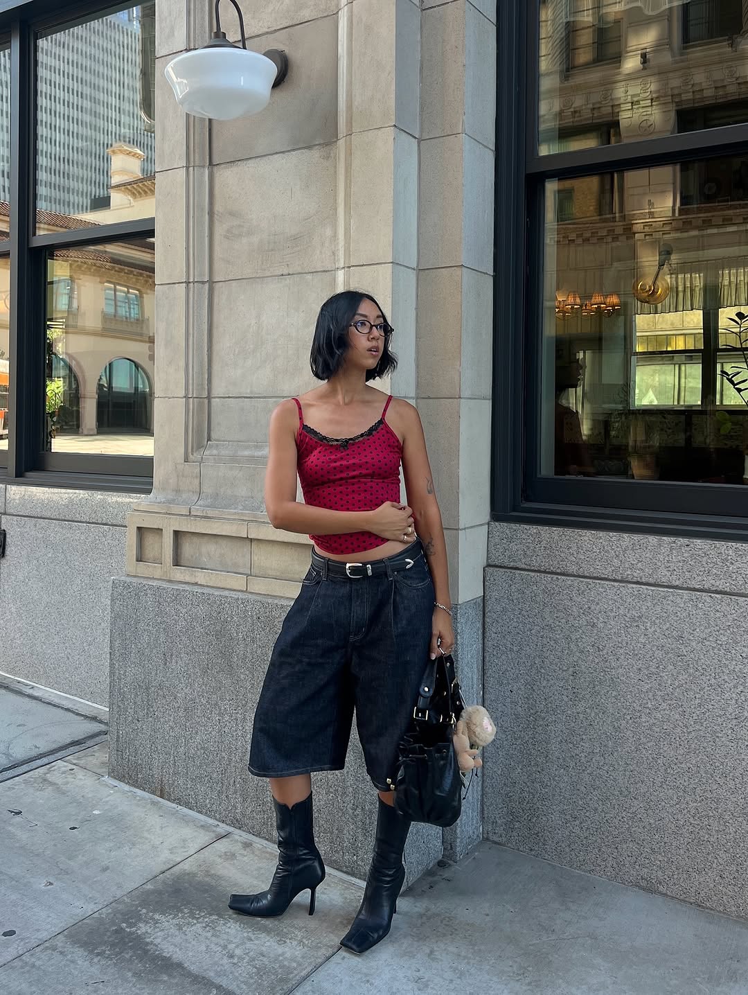 woman wearing bermuda shorts with boots outfit 2025