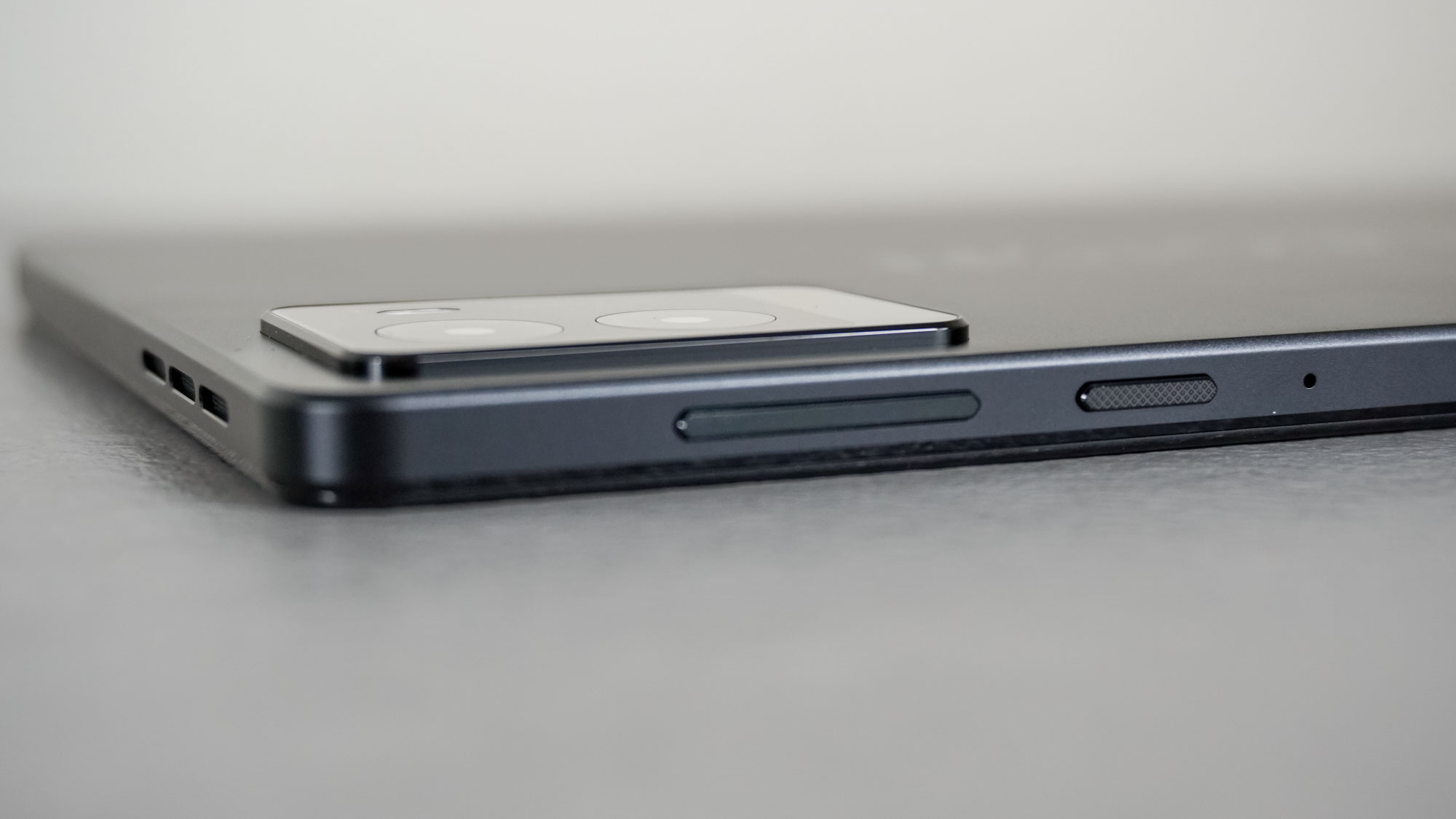 A close up shot of the rear cameras, volume buttons and the power button of the Lenovo Legion Tab Gen 3